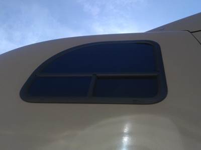 Mack Pinnacle CXU613 Left Sleeper Window for a Mack CXU613