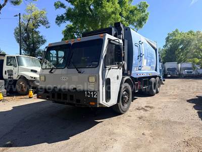 2013 Crane Carrier Co. Low Entry with Loadmaster 25 Cu Yard Rear Load Garbage Truck