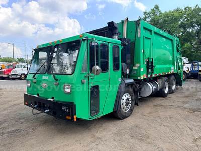 2016 Crane Carrier Co. Low Entry with Heil 25 Cu Yard Rear Load Garbage Truck