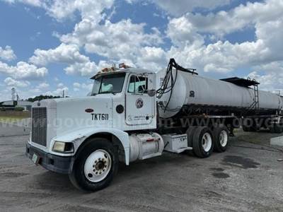 1989 Petetbilt 375 T/A Truck Tractor w/ 1994 Etnyre Black Topper 2X T/A Liquid Rubber Spray Tanker