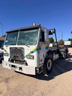2009 Peterbilt 320 6x4 COE Roll-Off Truck
