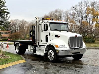Peterbilt 330 16-Foot Flat Deck Roll-Off Hook Truck