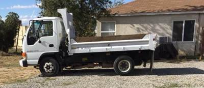 Isuzu NPR Tandem Axle Flatbed Dump Truck