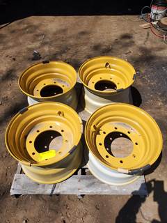 unused new Caterpillar rims for 450 skidsteer