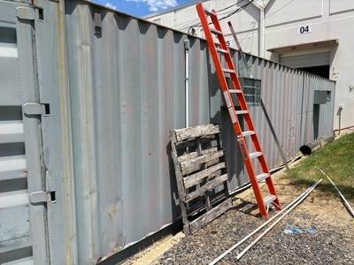 40' Modified Shipping Container w/Electricity, Lights, 2 AC Units, Carpeting & Some Shelving