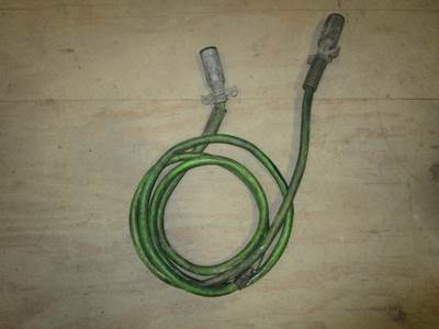 USED GREEN ABS TRAILER CABLE. ELECTRICAL TAPE ON SMALL SECTION