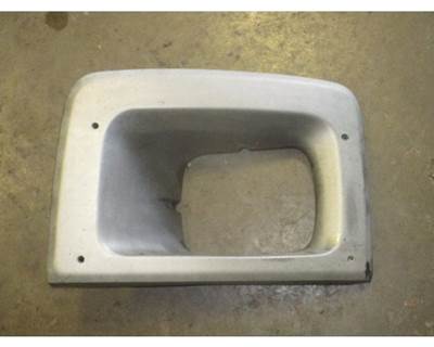 USED CHEVROLET C6500 HEADLIGHT BEZEL P/N: 15173201