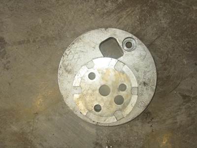 USED CUMMINS ISX15 IDLER GEAR MOUNTING SPACER PLATE. 
P/N: 4298650