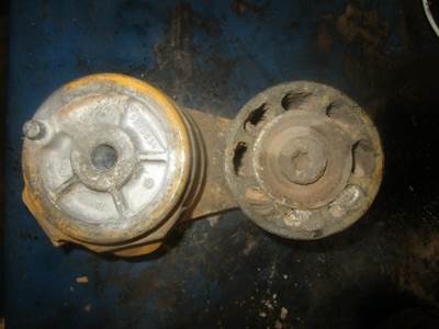 USED BELT TENSIONER PULLEY. 
P/N: 50-0034