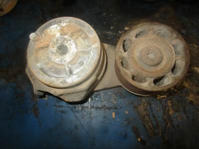 USED BELT TENSIONER PULLEY. 
P/N: 50-0034