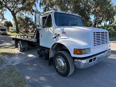 International 4700 Single Axle Rollback Tow Truck - T444E, 195HP, 5 Speed Manual