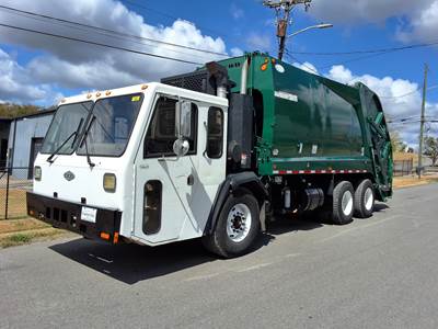 Crane Carrier (CCC) LET2 Tandem Axle Side Load Garbage Truck - Cummins, 5 Speed Allison Rds Automatic